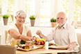 Aged-couple-having-food