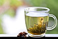 Green Tea : Closeup with cup of green tea with jasmine Stock Photo